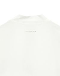 トラヴィスマシューのハイネックシャツ