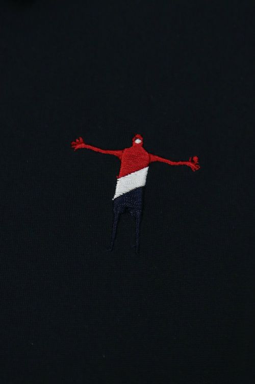 ティーマックのポロシャツ