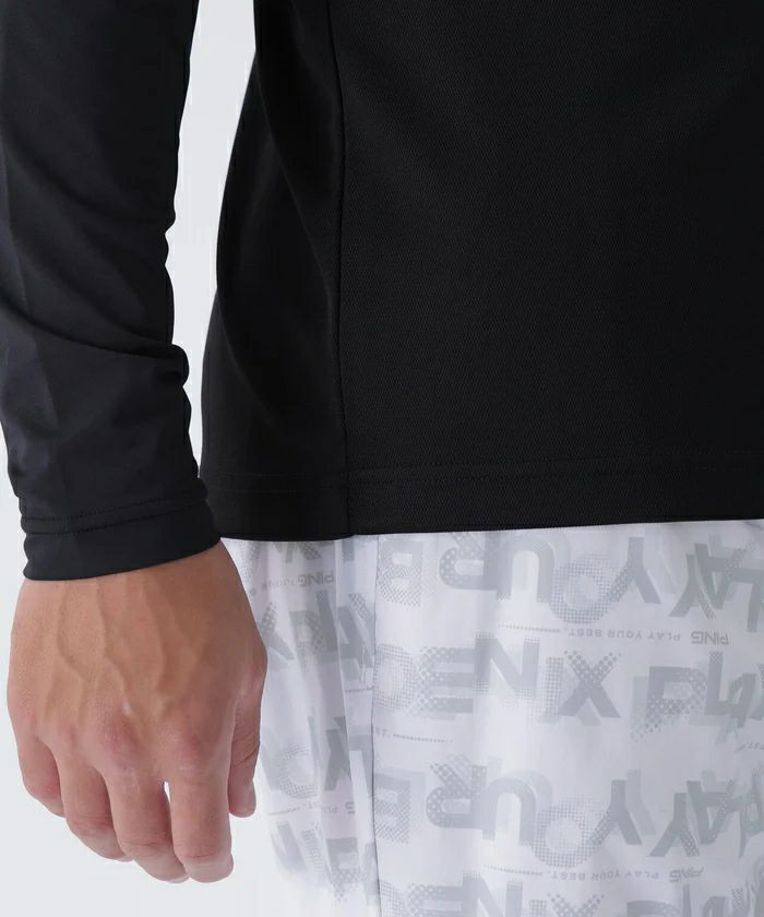 ピンのポロシャツ